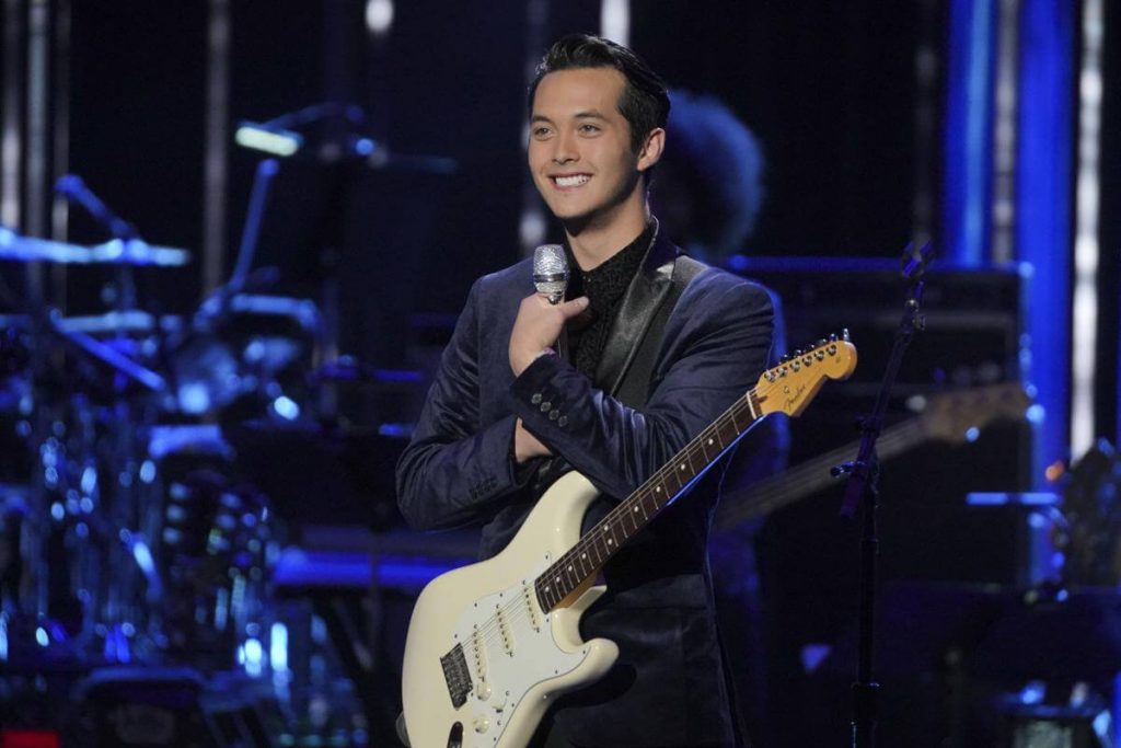 Laine Hardy holding a guitar on "American Idol" 2019