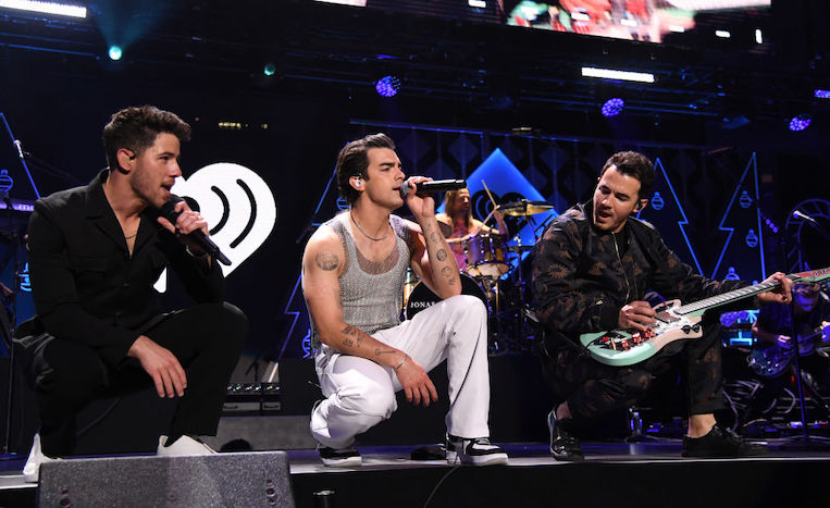 Nick, Joe, and Kevin Jonas perform at the iHeartRadio Z100 Jingle Ball 2021