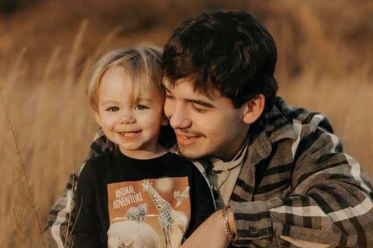 Portrait photo of Noah Thompson and his son