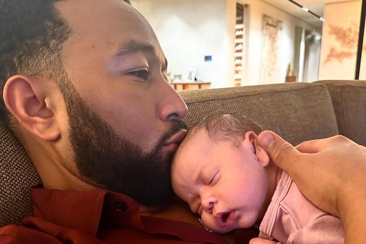 John Legend with his newborn