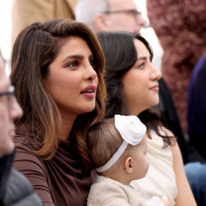 Priyanka Chopra with her child at the Hollywood Walk of Fame Ceremony for The Jonas Brothers