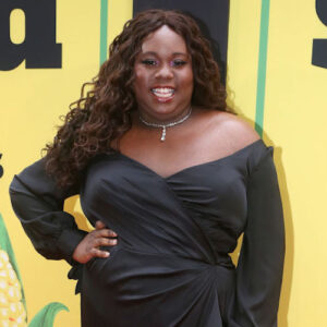Alex Newell on the Shucked red carpet