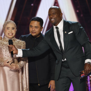 Putri Ariani on the 'America's Got Talent' stage with Terry Crews